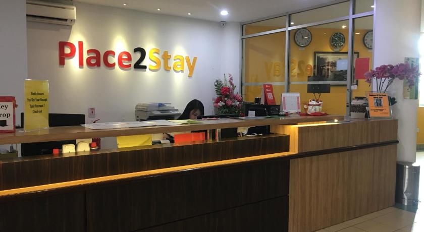 a restaurant with a large counter and a large window, Place2Stay @ Kenyalang in Kuching