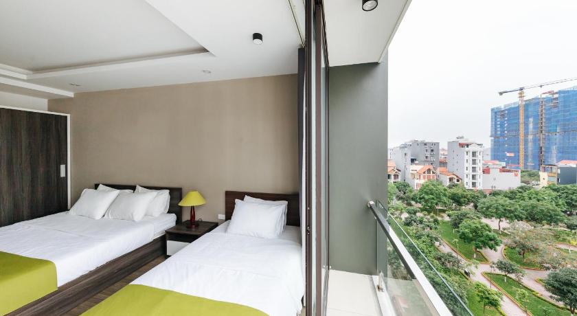 a hotel room with a bed and a window, Hana 2 Apartment and Hotel Bac Ninh in Bac Ninh