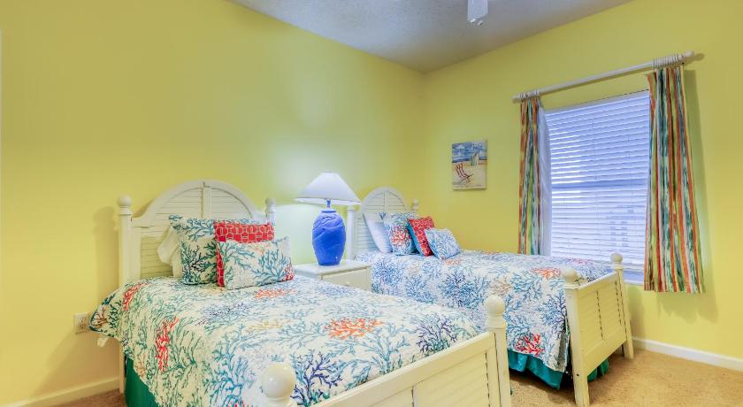 a bedroom with a bed, a desk, and a window, Sterling Sands 505 Destin (Condo) in Destin (FL)