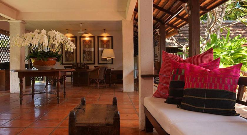 a living room filled with furniture and a patio, Tamarind Village Hotel (SHA Extra Plus) in Chiang Mai