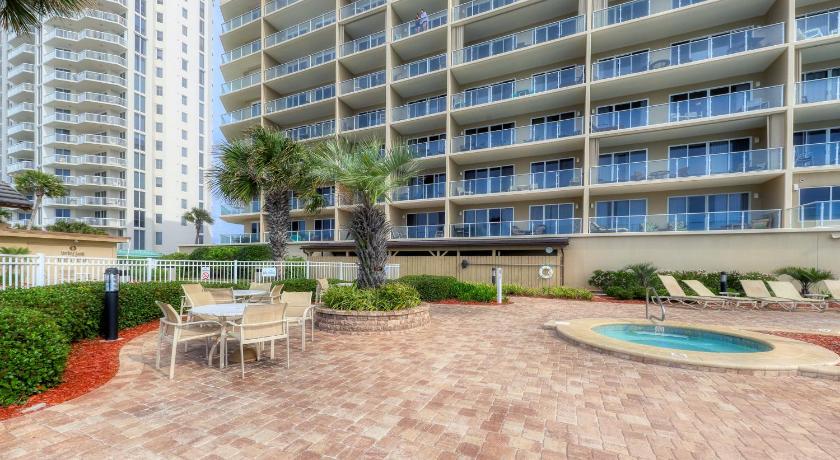 a large building with a patio area with tables and chairs, Sterling Sands 509 Destin (Condo) in Destin (FL)