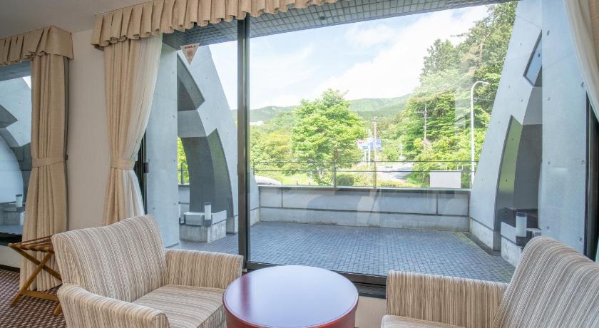 a living room filled with furniture and a window, Rembrandt Premium FujiGotemba in Gotemba
