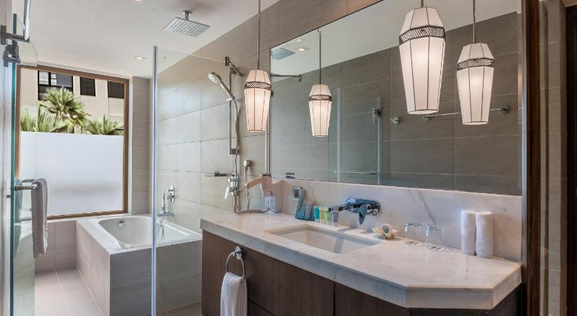 a bathroom with a sink and a mirror, Henann Prime Beach Resort in Boracay Island