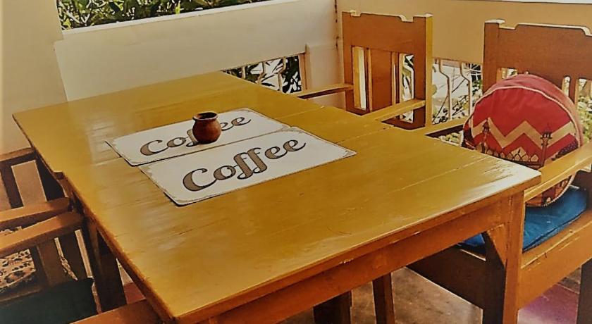 a table that has a cake on it, Villa Meena in Pondicherry
