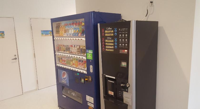 a refrigerator with a lot of magnets on it, Chura Cabin Kokusai-Dori in Okinawa Main island