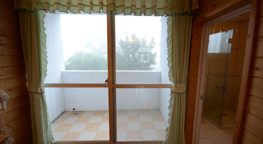 a bathroom with a window and a window blind, Sea of Clouds Vacation Villa I in Nantou