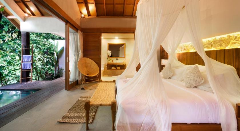 a hotel room with two beds and a large window, Kalapa Boutique Resort & Yoga in Bali