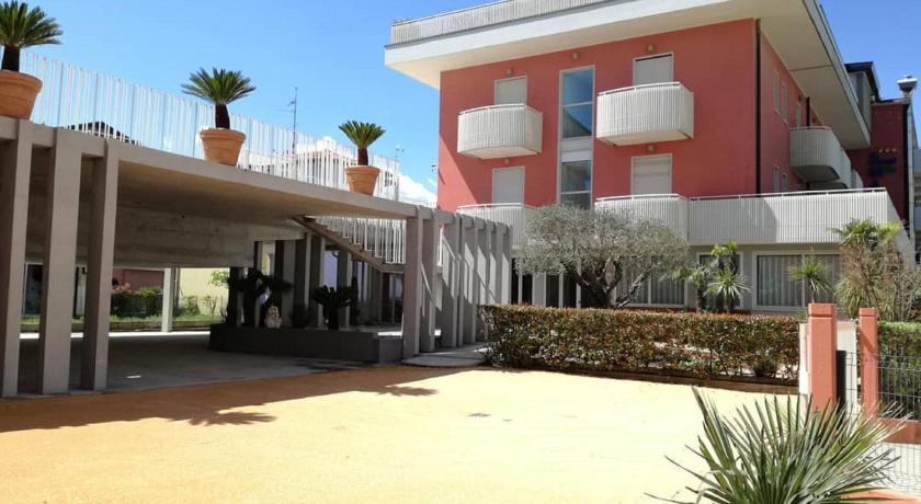 a large white building with a lot of windows, Hotel Villa Maria in Caorle