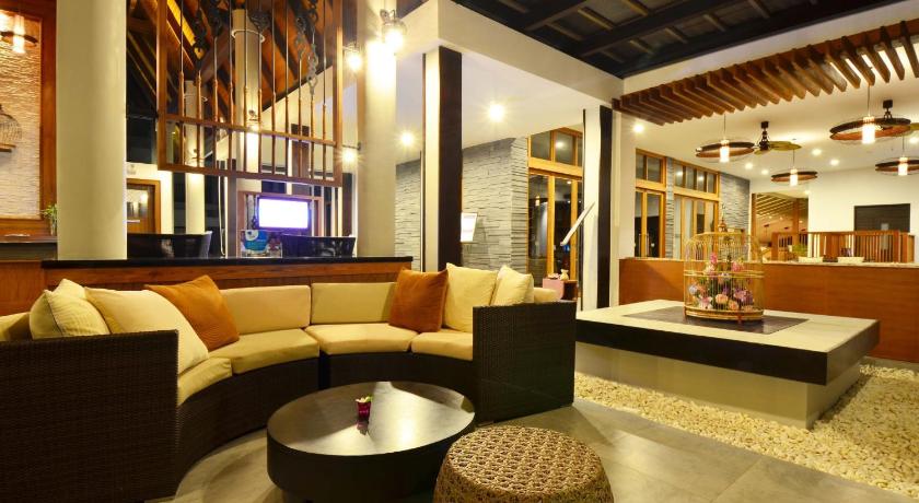 a living room filled with furniture and a tv, DEEVANA PLAZA Krabi Aonang (SHA Extra Plus) in Krabi