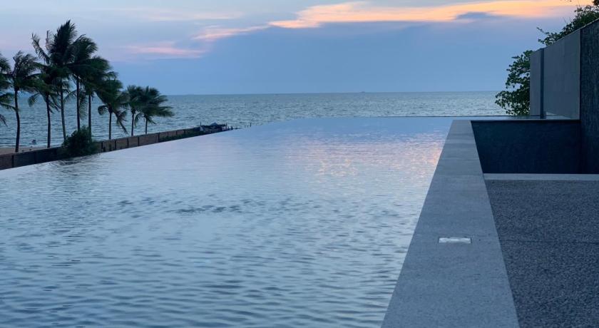 a beach scene with a body of water, Ana Anan Resort & Villas Pattaya (SHA Extra Plus) in Pattaya