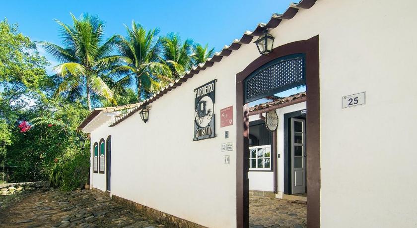 a building with a clock on the front of it, Pousada Pardieiro in Paraty