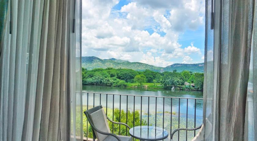 a view from a balcony overlooking a lake, The Glory River Kwai Hotel in Kanchanaburi