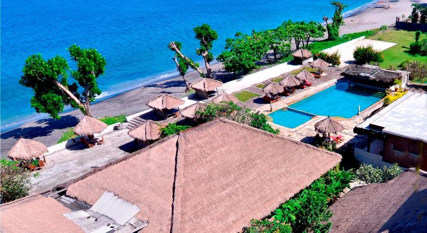 a view of a beach with palm trees and palm trees, Pasific Beach Cottages in Lombok
