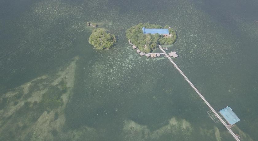 an aerial view of a body of water with a stop sign, Enchanted River Rock Island Resort in Hinatuan