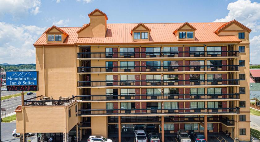a large brick building with a large clock tower, Mountain Vista Inn & Suites - Parkway in Pigeon Forge (TN)
