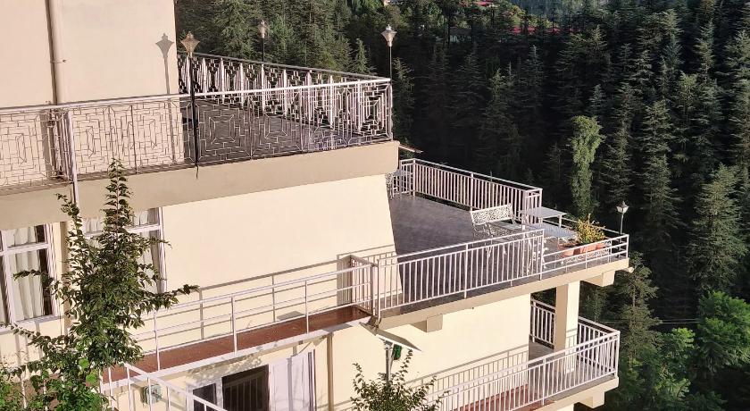 a large building with a view of a mountain range, Vatsalyam Home Stay in Shimla