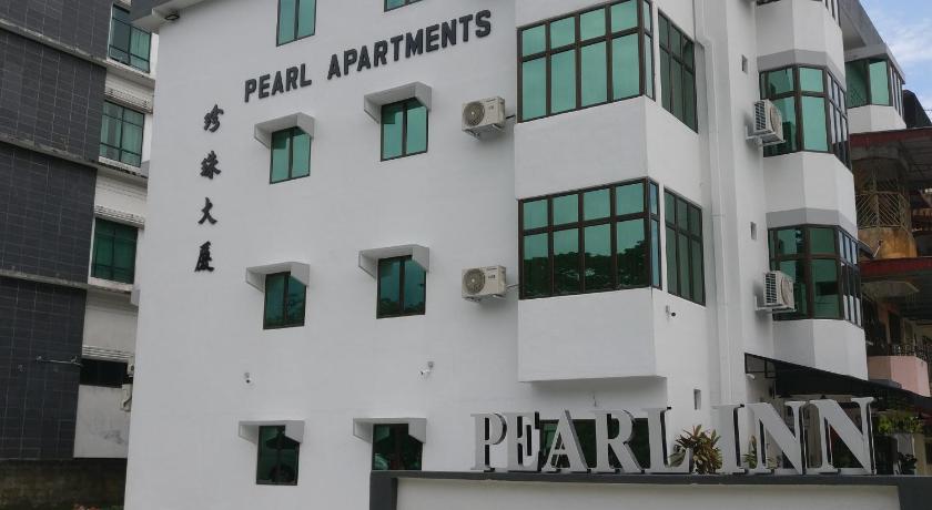 a large white building with a large window, Pearl Inn in Taiping