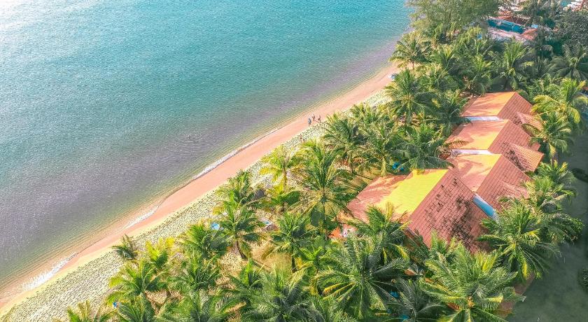 a beach with palm trees and palm trees, Famiana Resort and Spa in Phu Quoc Island