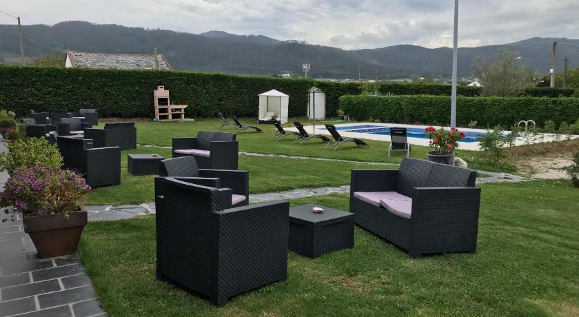 a pile of luggage sitting on top of a grass covered field, villas las catedrales in Ribadeo