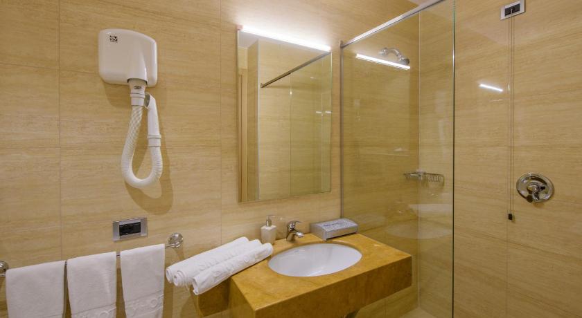 a bathroom with a shower, sink, and toilet, Sky 2 Hotel Tirana in Tirana