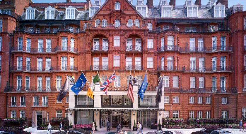 a large building with a clock on the front of it, Claridge's in London