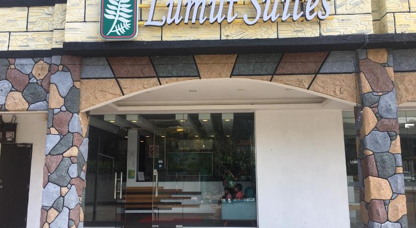 a building with a sign on the front of it, Lumut Suites in Lumut