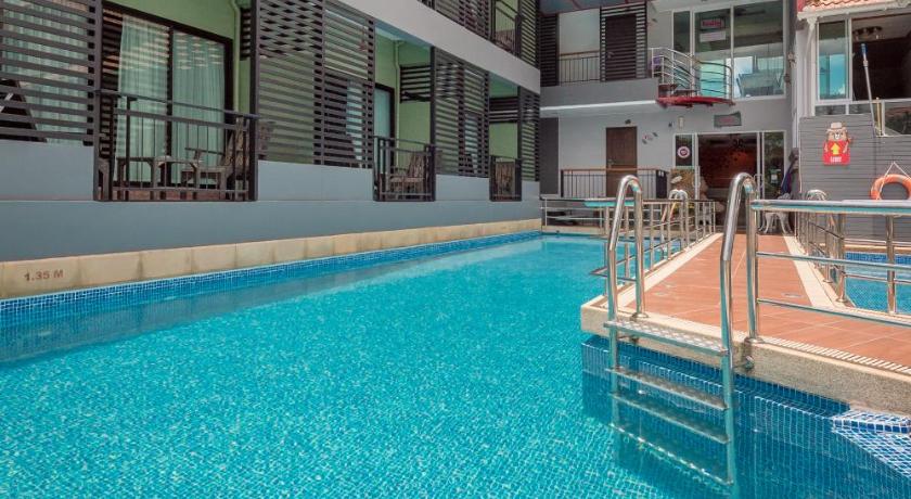 a large swimming pool in a large building, Chayadol Resort (SHA Extra plus) in Chiang Rai
