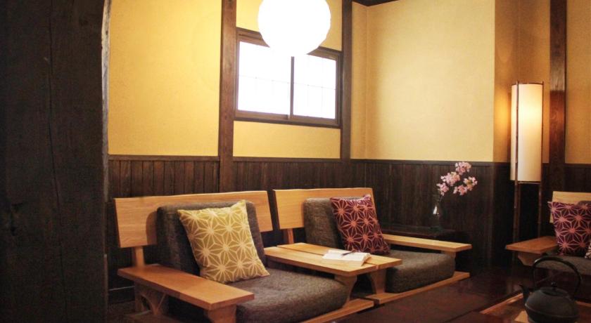 a living room filled with furniture and a window, K's House Takayama - Quality Hostel in Takayama