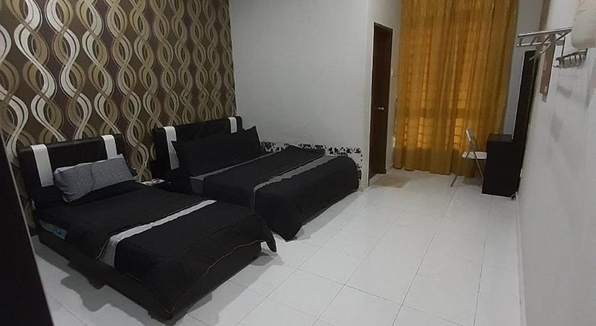 a living room filled with furniture and a large window, Selesa Indah Guest House Melaka - Near City Centre in Malacca