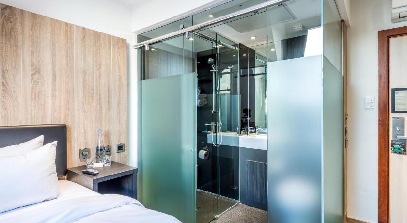 a hotel room with a bed and a shower, The Z Hotel Glasgow in Glasgow