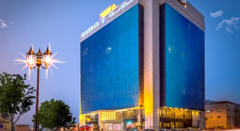 a large building with a clock on the side of it, Grand Plaza Hotel - Gulf Riyadh in Riyadh