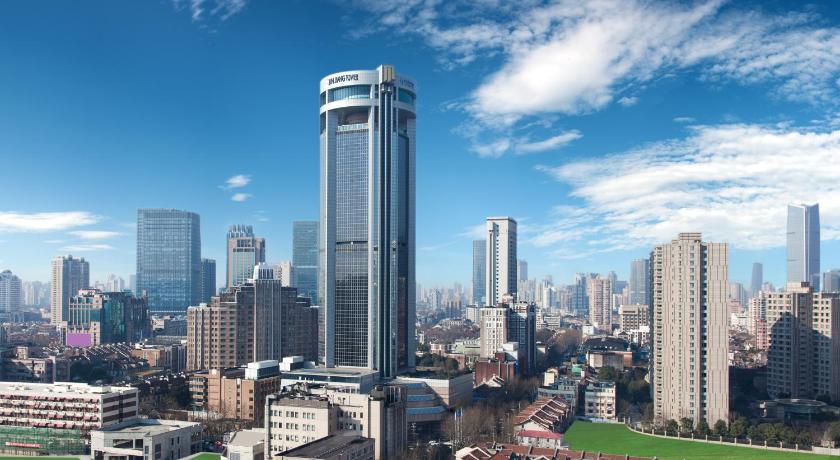 a city with tall buildings and tall buildings, Jin Jiang Tower Hotel in Shanghai