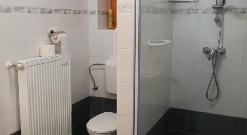 a bathroom with a shower, toilet, and sink, Soos Villa Balaton in Balatongyorok