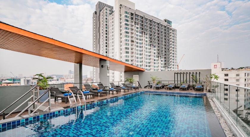 a large swimming pool in the middle of a city, 247 Boutique Hotel in Pattaya