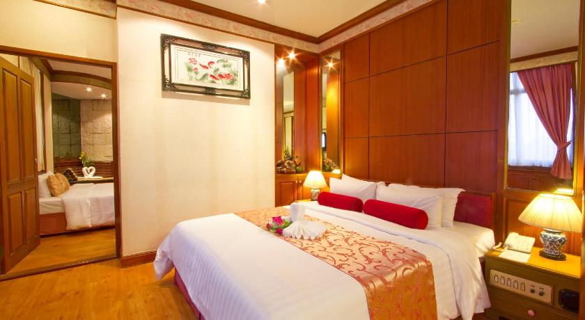 a hotel room with a bed and a dresser, China Town Hotel (SHA Plus+) in Bangkok