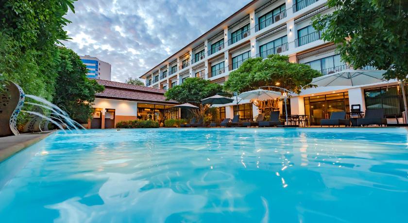 a large swimming pool in a large building, The Pannarai Hotel (SHA Extra Plus) in Udon Thani