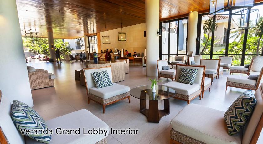 a living room filled with furniture and a large window, Fairways and Bluewater Boracay in Boracay Island