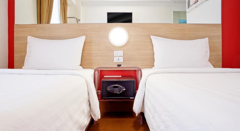 a hotel room with two beds and two lamps, Red Planet Davao in Davao City