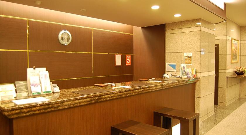 a kitchen area with a counter and a counter top, Hotel Route Inn Nagahama Inter in Nagahama