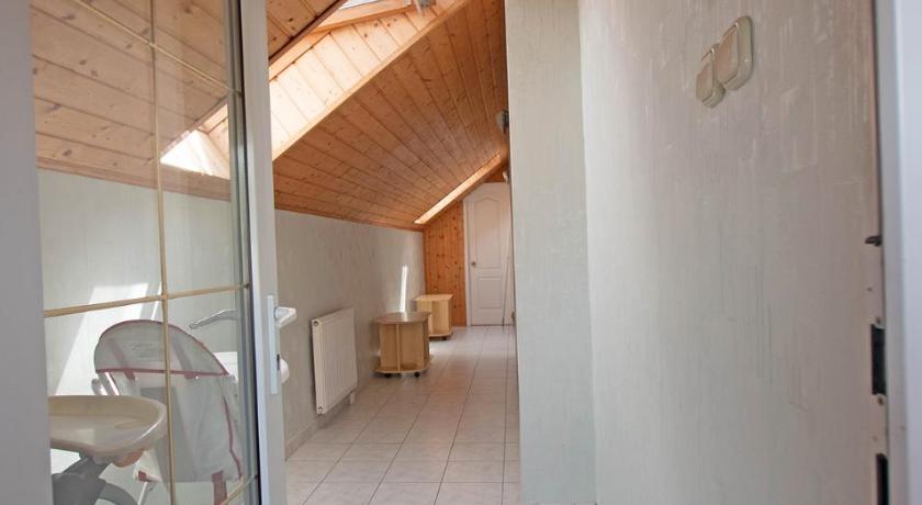 a bathroom with a door open and a toilet in the corner, Greta haz in Balatonlelle