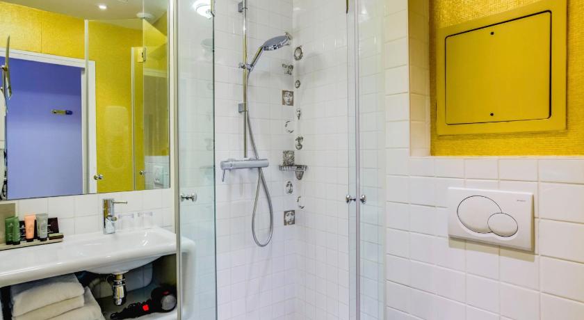 a bathroom with a shower, sink, and toilet, Hotel Joyce - Astotel in Paris