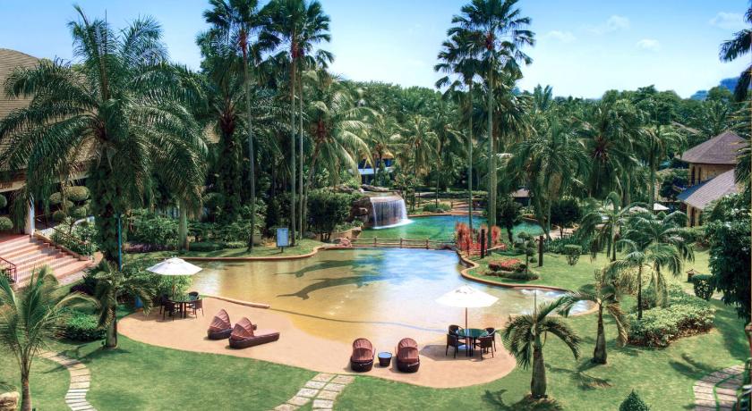 a beach with palm trees and palm trees, Cyberview Resort  Spa in Kuala Lumpur