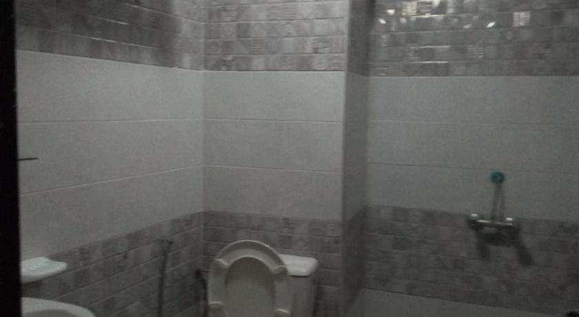 a bathroom with a toilet, sink, and shower stall, Hotel Darna in Rabat