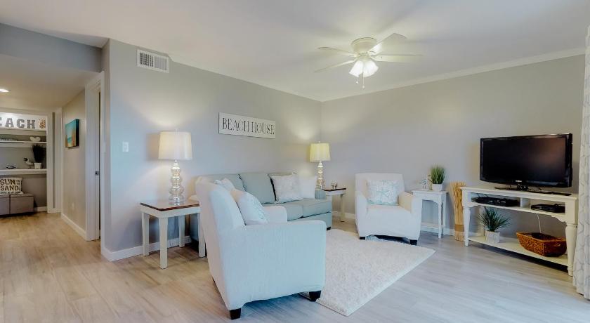 a living room filled with furniture and a tv, Seascape Golf Villas 7B in Destin (FL)