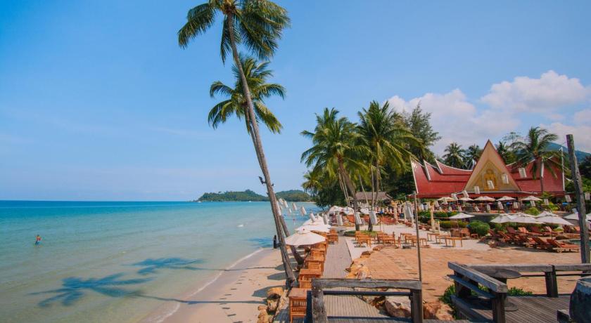 a beach with palm trees and palm trees, Santhiya Tree Koh Chang Resort   in Koh Chang