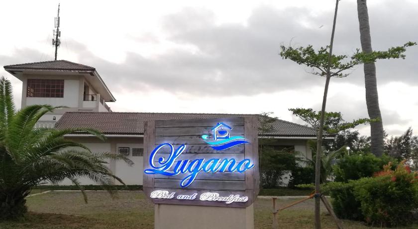 a sign that is on the side of a building, Lugano Bed and Breakfast in Santa Ana (Cagayan)