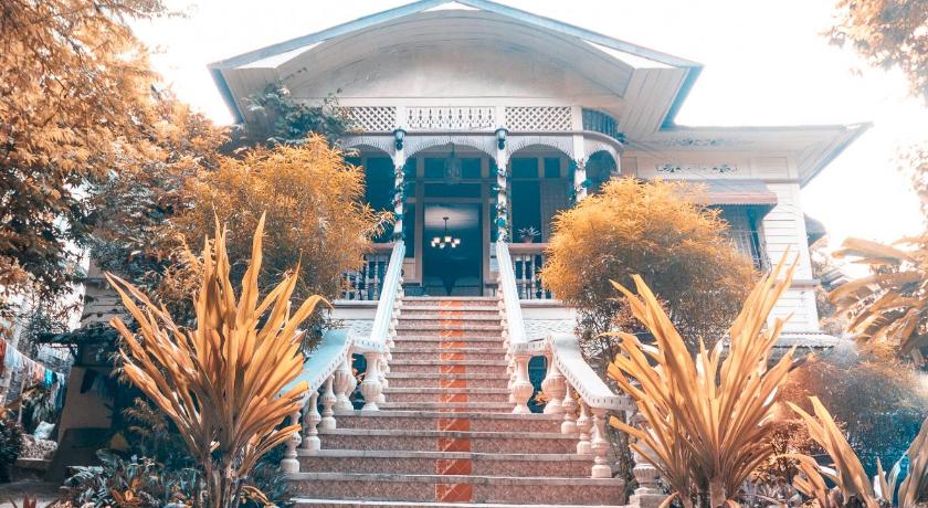 a staircase leading up to a white house, Oasis Balili Heritage Lodge in Bohol