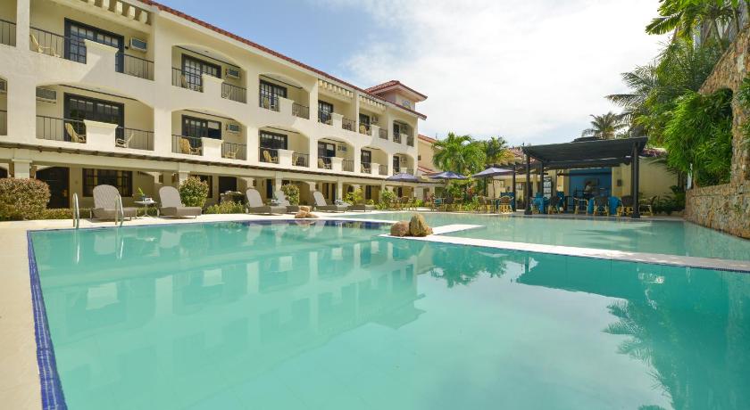 a large swimming pool in front of a large building, Le Soleil de Boracay Hotel in Boracay Island