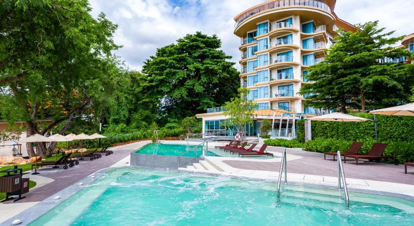 a large swimming pool in front of a large building, Centara Sonrisa Residence and Suites Sriracha (SHA Extra Plus) in Chonburi