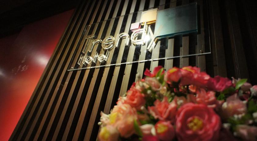 a pair of scissors cutting into a flower, Trendy Hotel in Nakhon Pathom